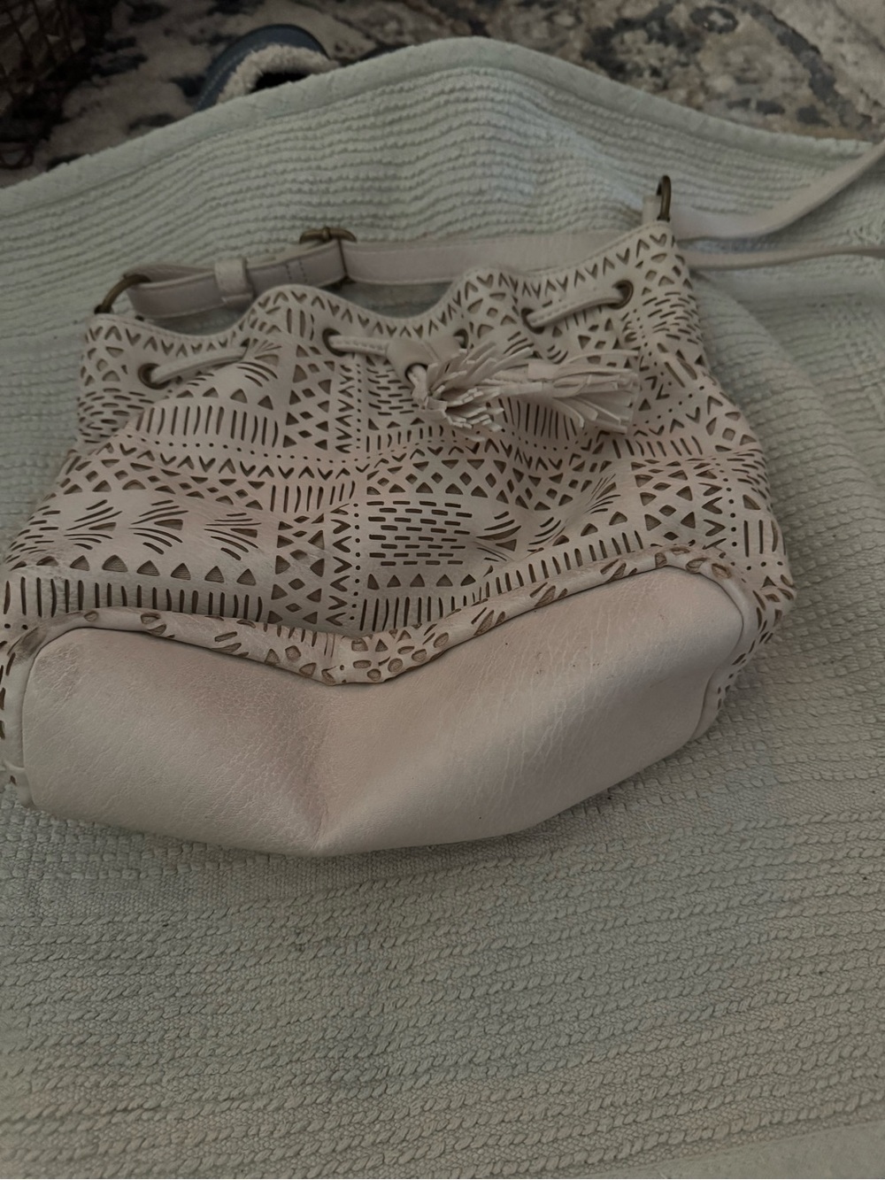 Cream Laser-Cut Drawstring Shoulder Bag with Tassel